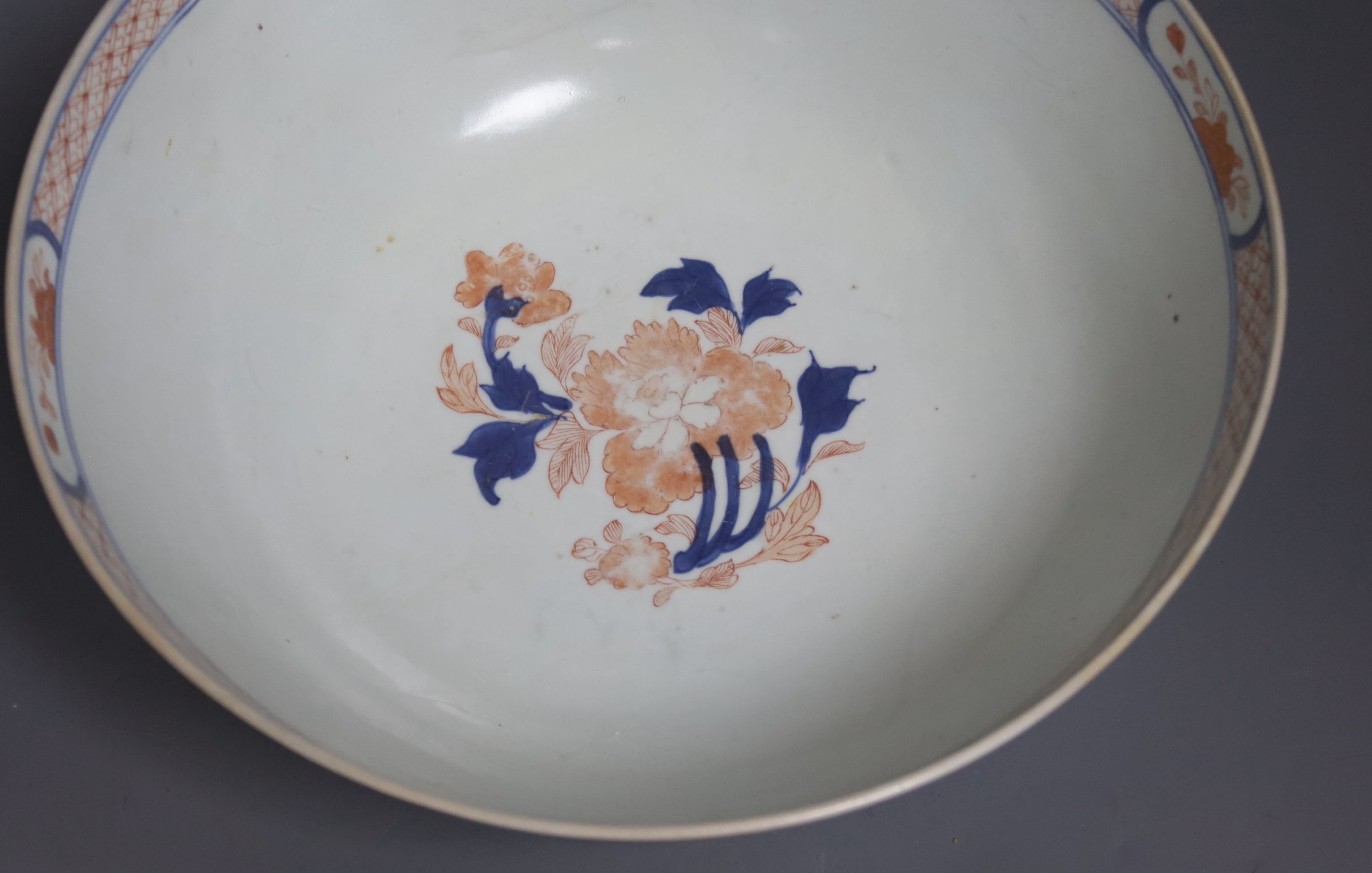 Three 18th century Chinese export porcelain bowls, largest 28 cm and two plates
